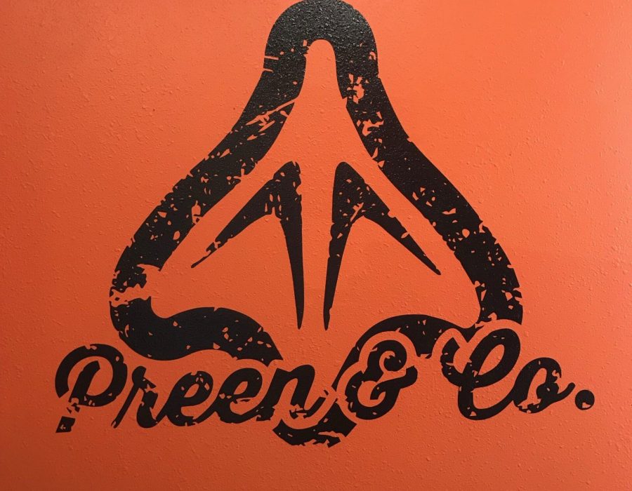 Preen & Co orange wall mural
